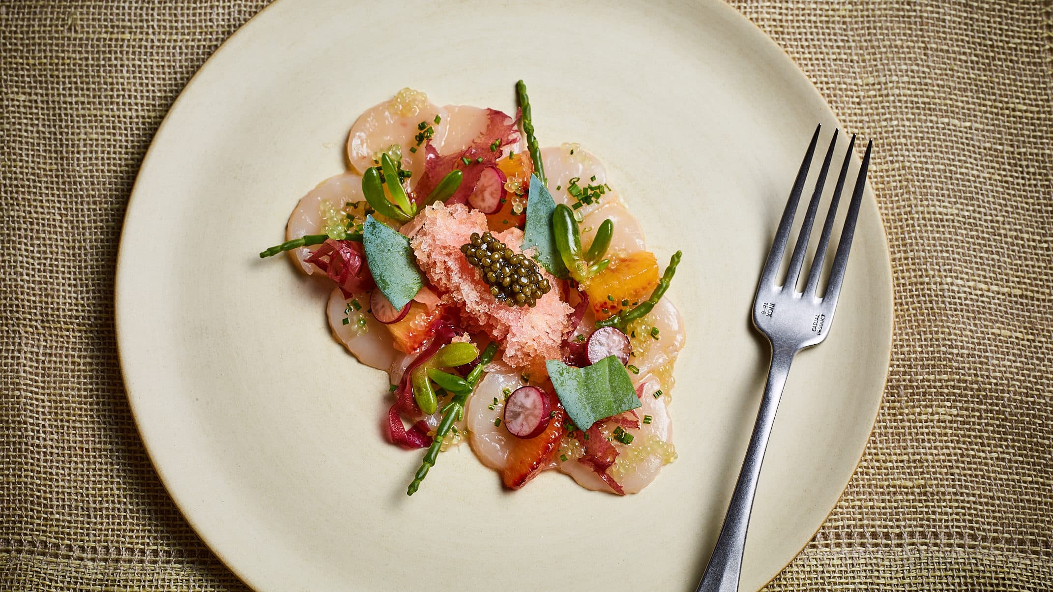 Ceviche of scallops with blood orange granité
